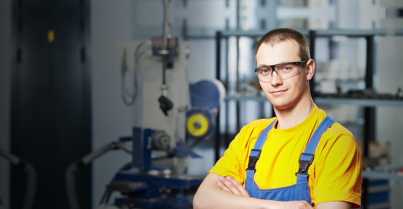 Smiling handyman in uniform representing Fix It Ottawa’s professional handyman services.
