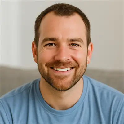 Male customer smiling on couch after successful faucet and sink installation in Nepean